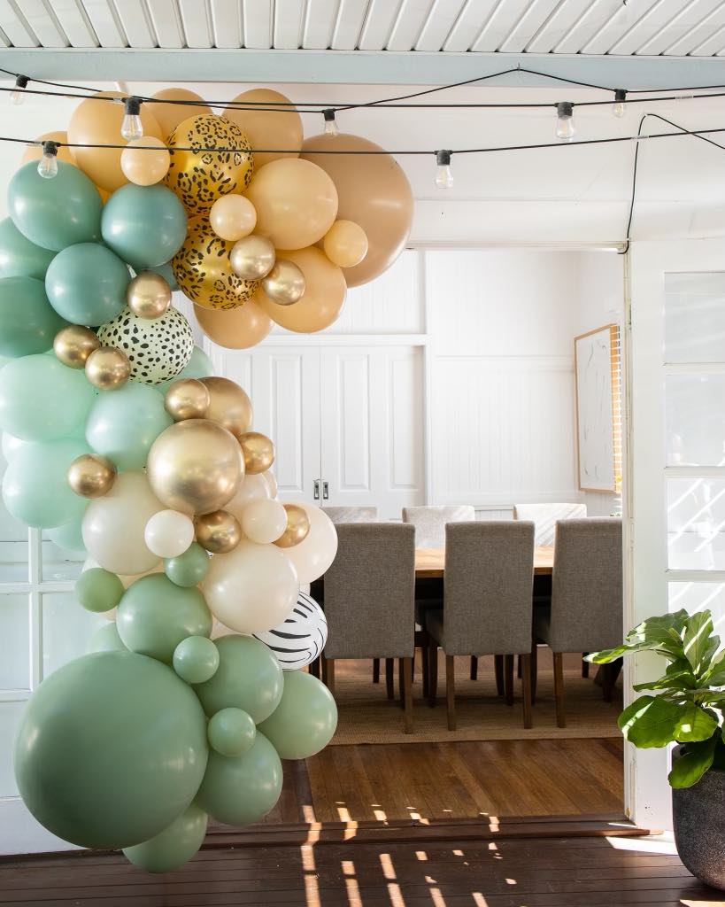 Balloon Garland styled on back patio for outdoor party