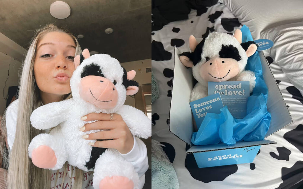 woman receiving Cooper the Cow stuffed animal