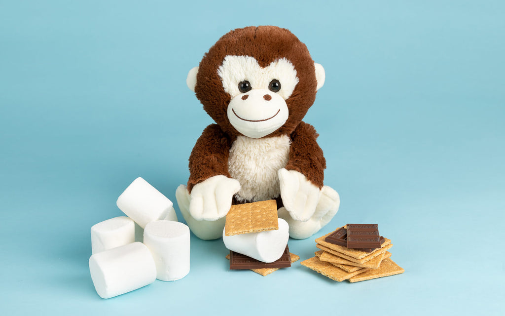 monkey stuffed animal assembling smores