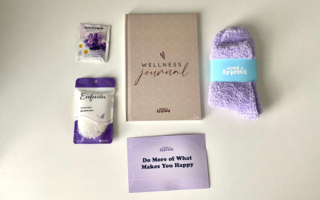 lavender bath soak, tea, fuzzy socks, and a wellness journal