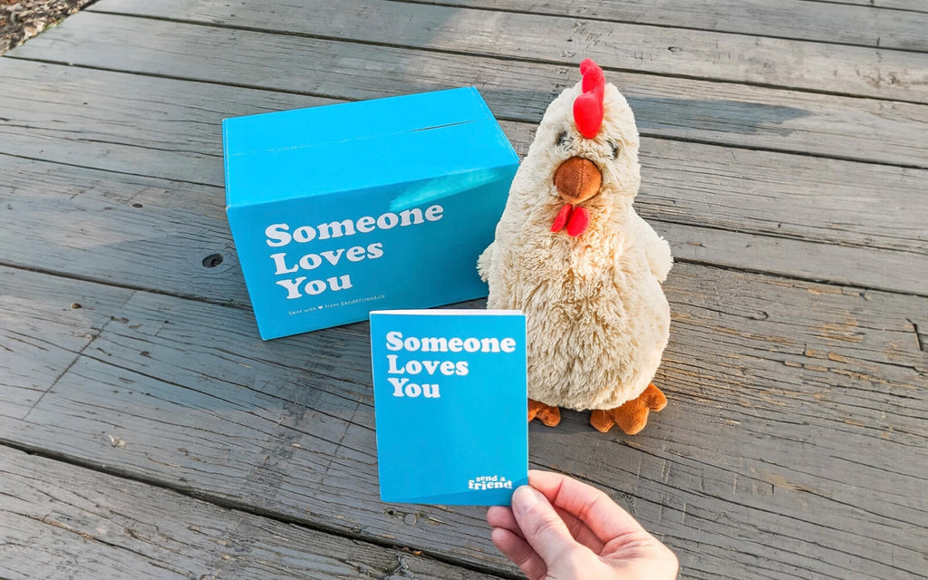 Rowdy the Rooster stuffed animal with "someone loves you" box and notecard