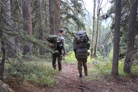 Cro-Mag Outdoors' Chris and Aidan walking with packs on at Colorado GMU 74