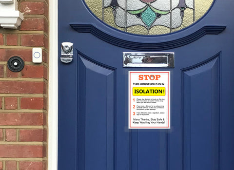 Image of a Covid 19 self isolation poster on a front door