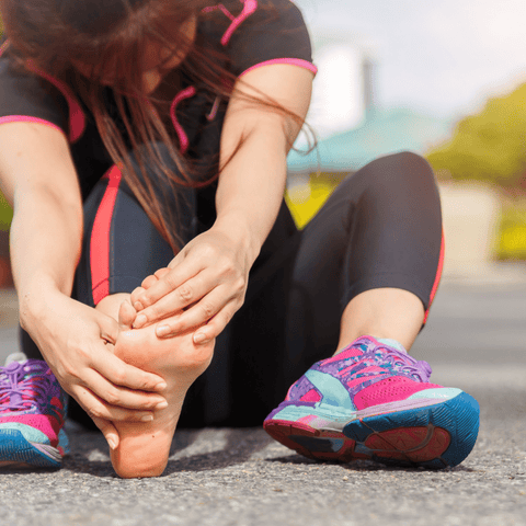 runner suffering from a foot pain