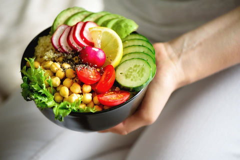 Girl Holds in Hands Vegan Food