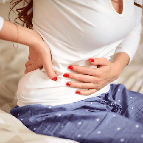 mother suffering from abdominal pain