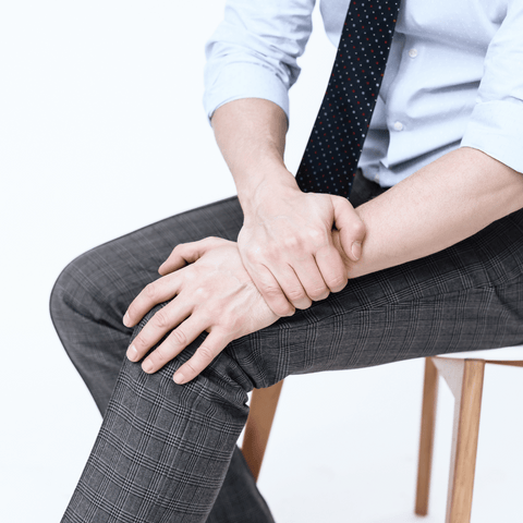 man sitting suffering from seronegative rheumatoid arthritis