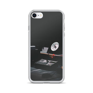 An iPhone case picturing a radio control station, with a clock, phone and some recording equipment.  Dark, sleek iPhone cases with custom photography