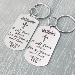 silver stainless steel dog tag keychain engraved with "Godmother. A gift from above for guidance & love". Engraved with name Eva Claire and the baptism date 6.8.21