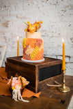 70s style vintage wedding cake and candles 