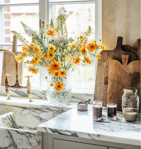Fresh flowers styled in a kitchen to add softness and greenery