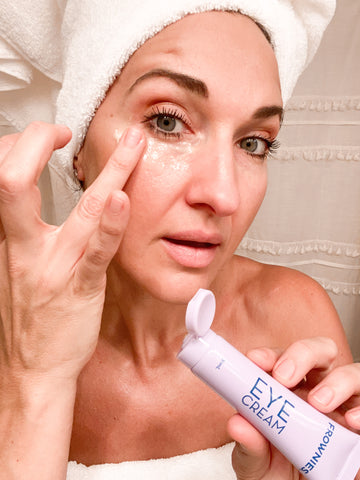 woman applying Frownies Eye Cream to under eyes