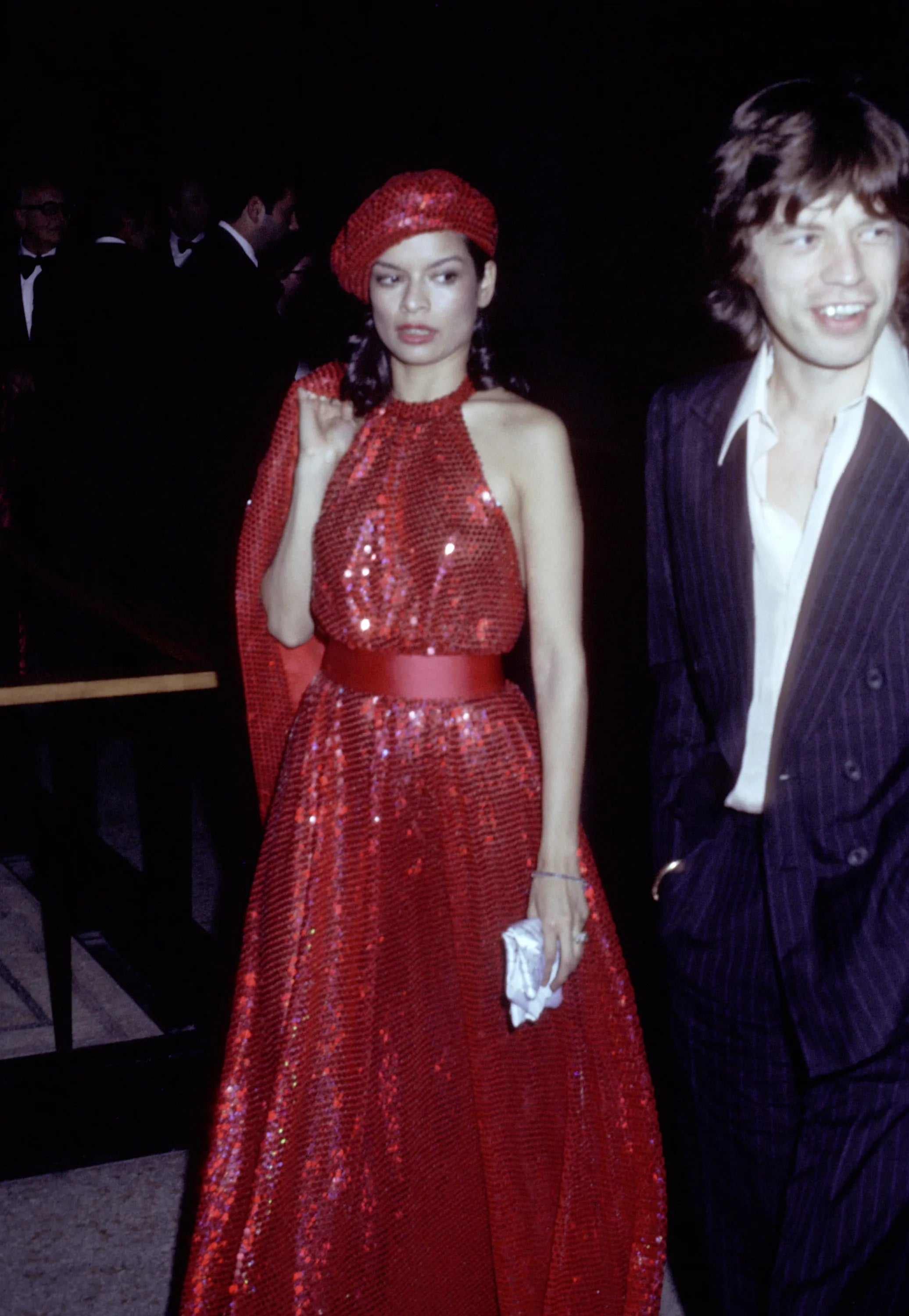 Bianca & Mick Jagger in a red sequin dress