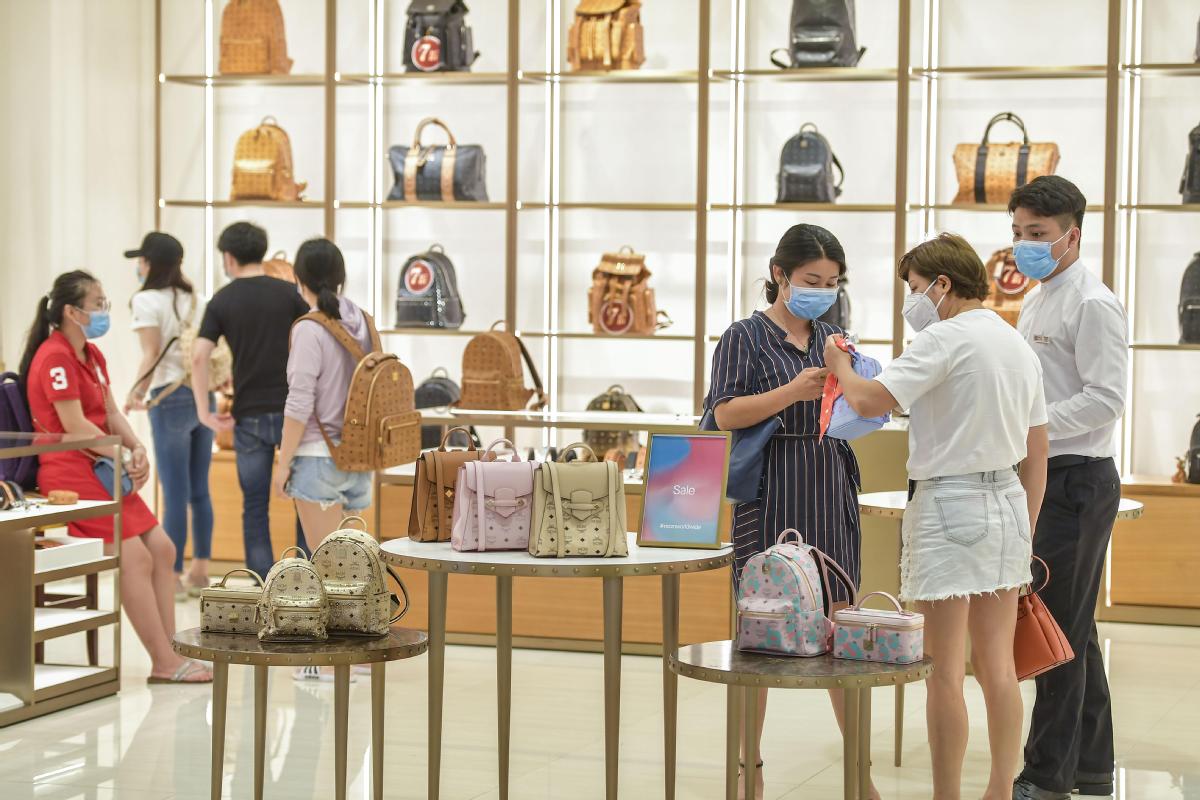 How COVID-19 Affected The Luxury Market masked shoppers