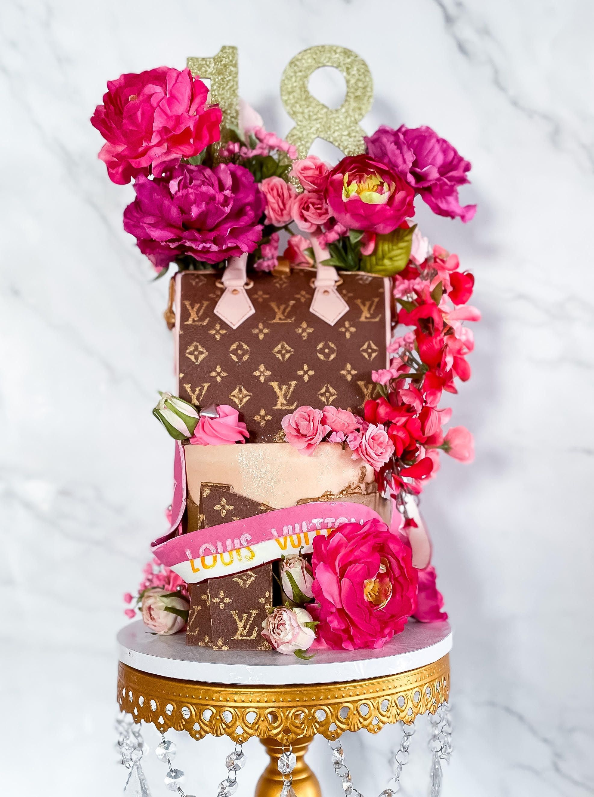 louis vuitton speedy cake decorated with flowers