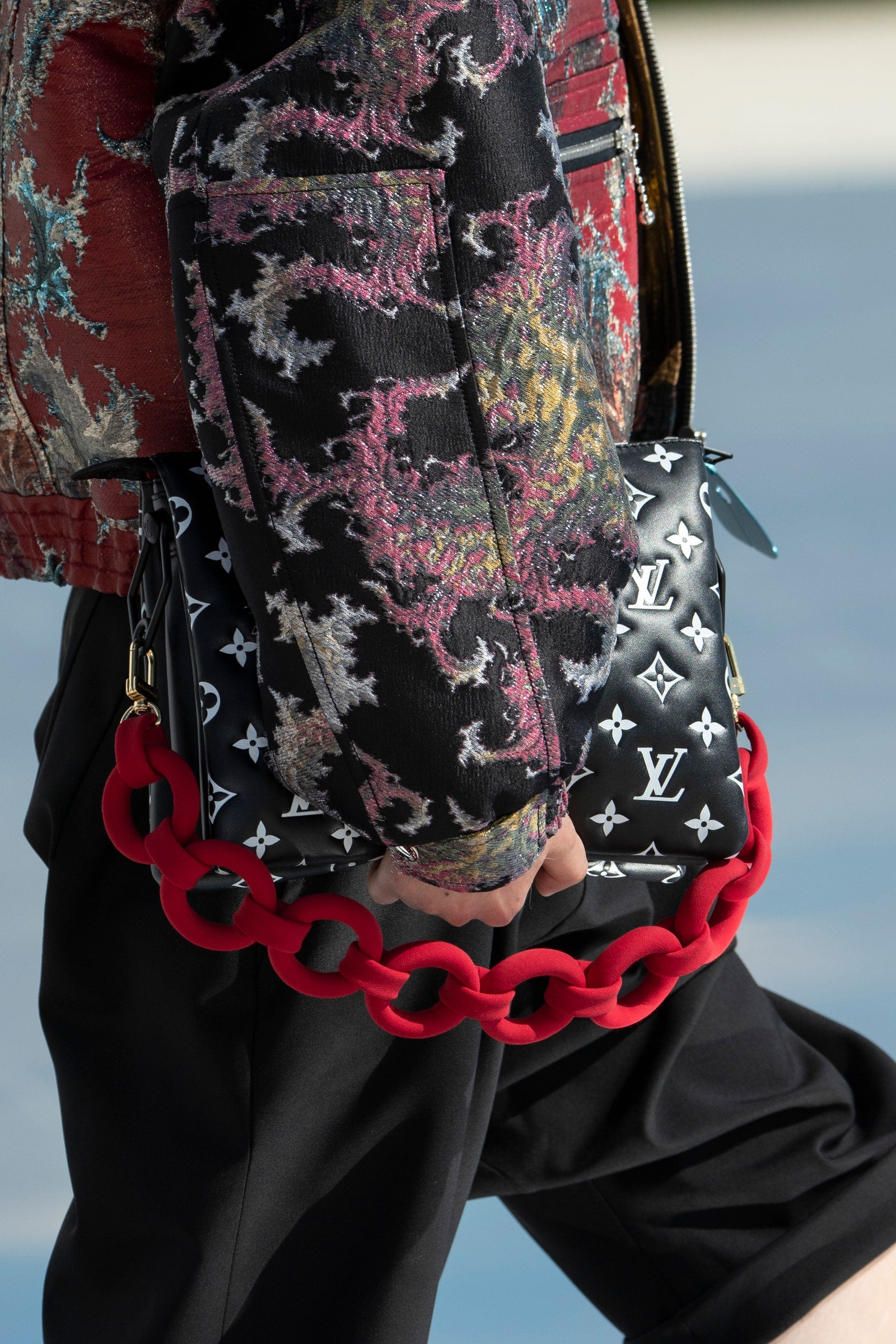 All the New Accessories from Louis Vuitton Cruise 2022 coussin with a contrasting chain and black and white empreinte