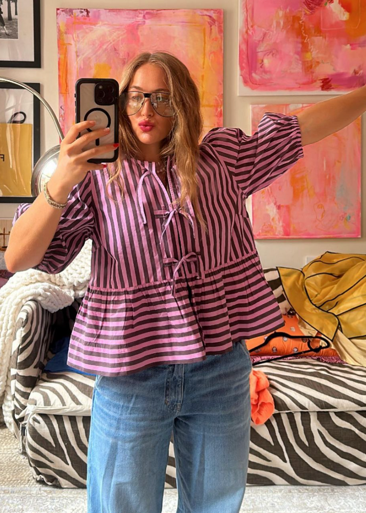 Ganni striped top with baggy jeans