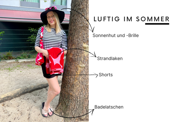 Ilma von Marimekko durch die Jahreszeiten: im Sommer mit Sonnenhut, rotem Badetuch und Handtasche, schwarzen Shorts und Badeladtschen