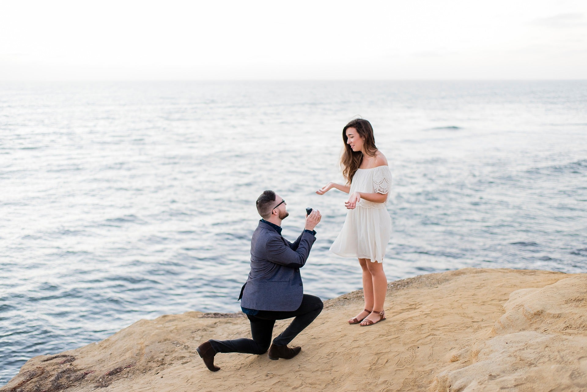 man proposing during a surprise proposal 