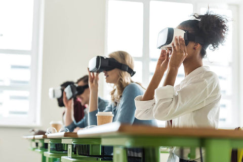 Female Students in Class wearing Virtual Reality Headsets
