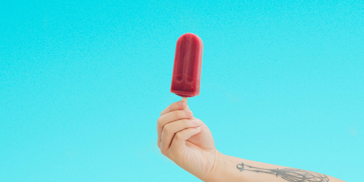 Hand with Pomegranate Hibiscus Tea Iced Pop