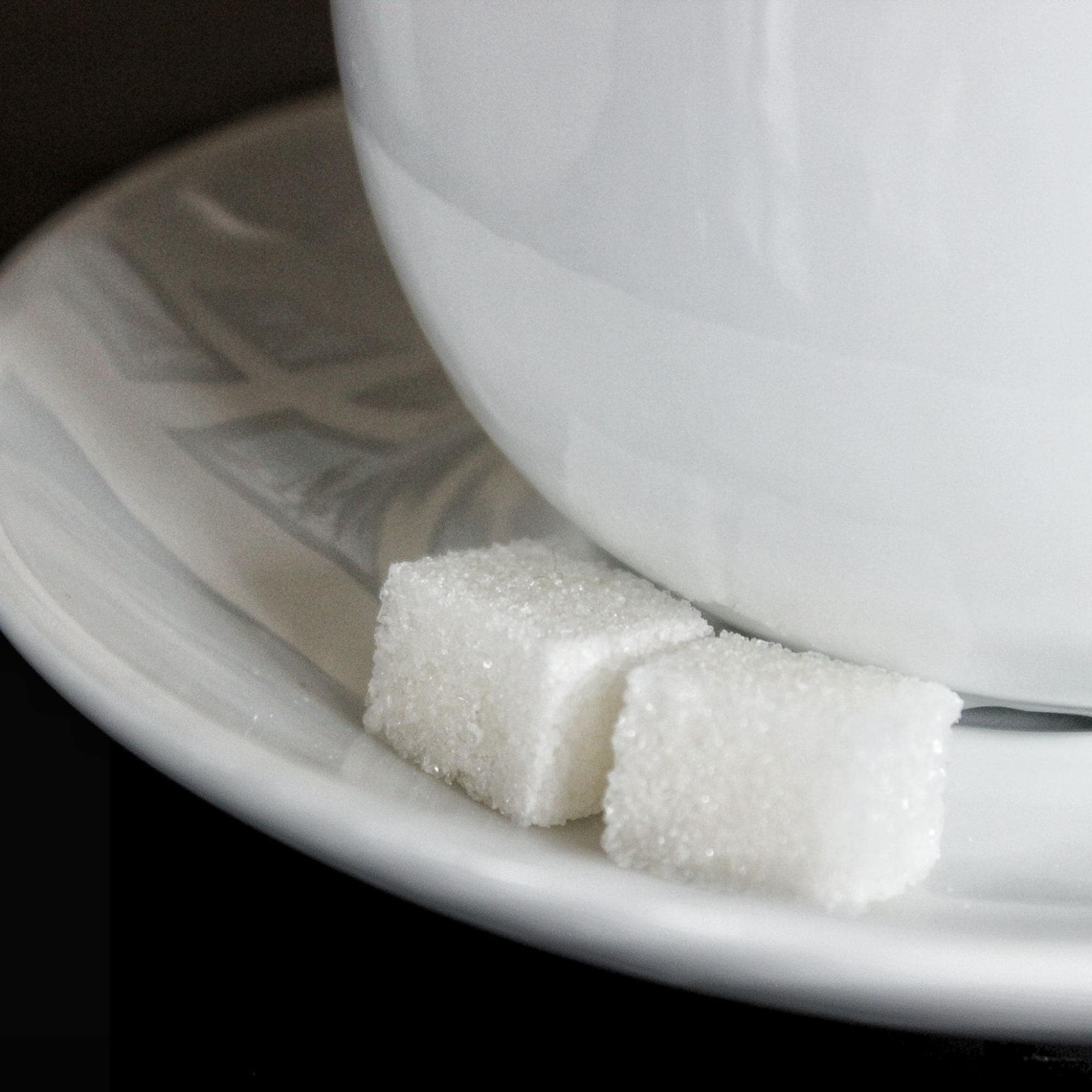 Picture of sugar cubes on tea plate