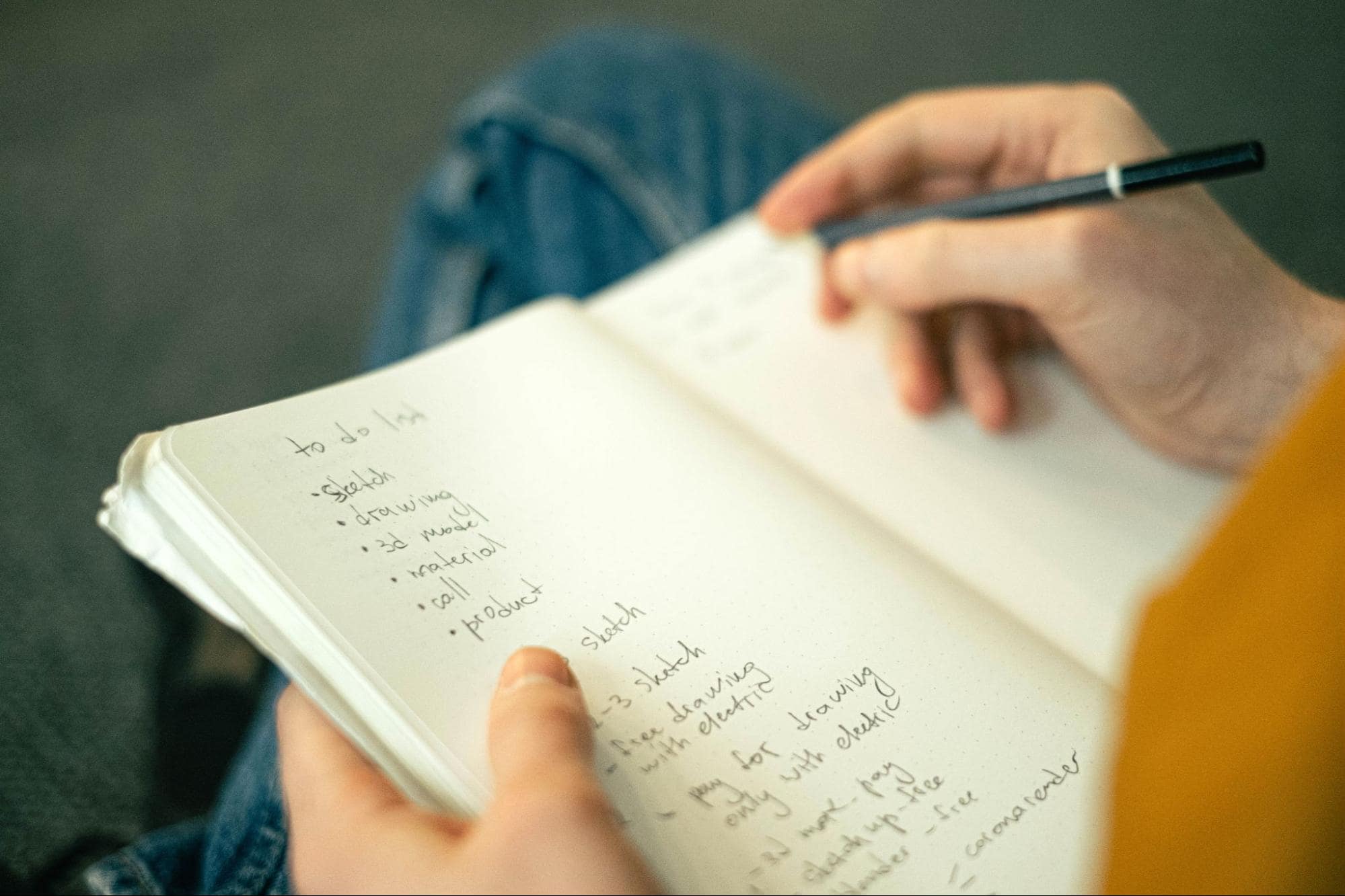 Image of person writing in their journal