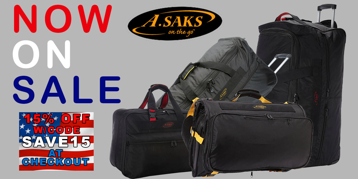 a. saks luggage sale banner in red,white and blue letters and 4 pieces of asaks luggage piled on top of each other