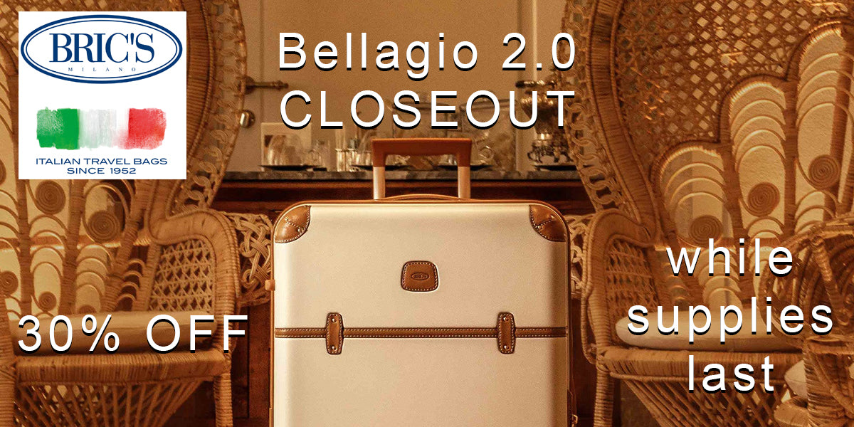 brics bellagio sale showing bellagio suitcase next to 2 large wicker high back thrown chairs as the background