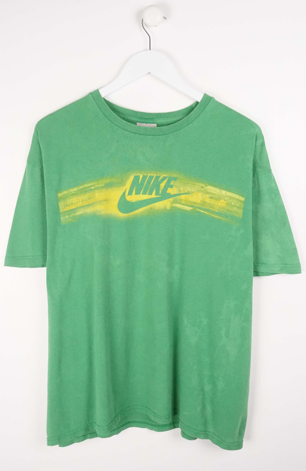 green and yellow nike shirt