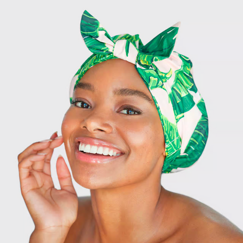 Bebonia model wearing a kitsch shower cap to protect her curls