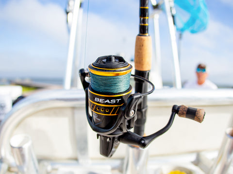 Spinning fishing reel and rod on saltwater fishing boat 