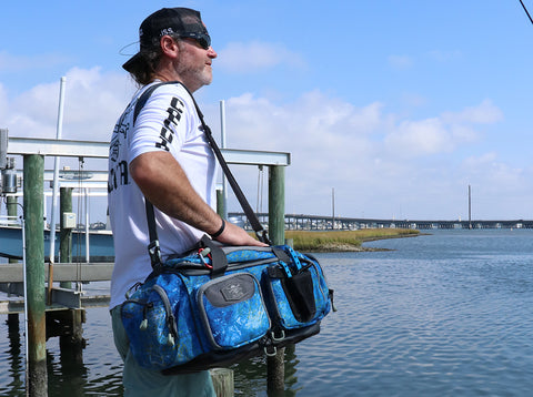 Fisherman carrying a Calcutta Outdoors Squall 3700 Tackle Bag