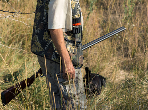 Dove hunter wearing a camouflage hunting vest