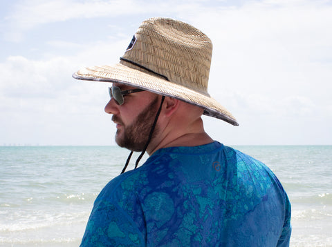 Fisherman wearing a Calcutta Outdoors straw hat
