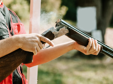 Shooter unloading shotgun with finger off trigger