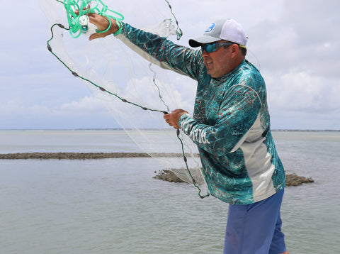 Captain Noah Lynk throwing a cast net