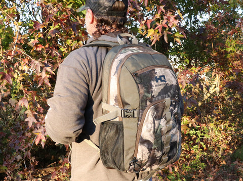 Hunter carrying gear in an HQ Outfitters Day Pack