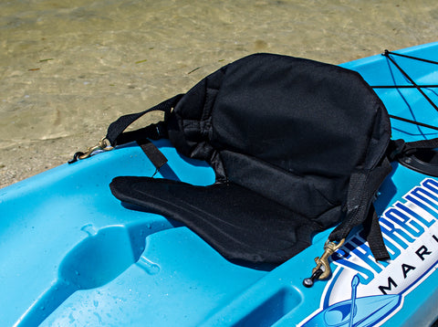 Padded kayak seat attached to a sit-on-top kayak