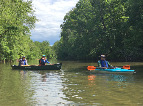 Paddling a canoe and kayak on a river