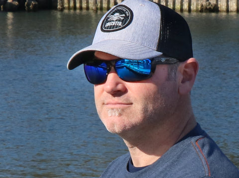 Fisherman in Calcutta cap wearing polarized sunglasses