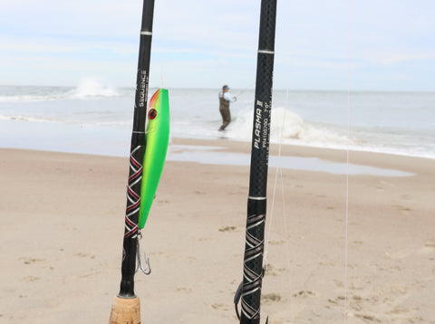 Star Rods spinning rods with green bait on beach