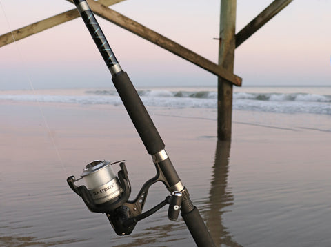 Surf fishing rod and reel combo at pier on beach