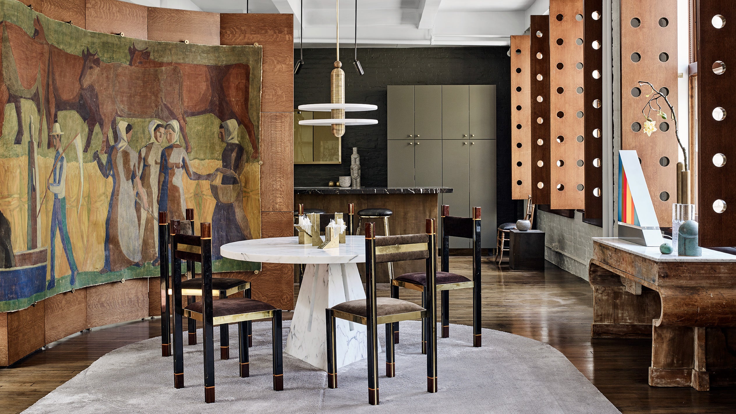 A MEDIAN : 1 ceiling pendant hanging over a circular dining table at the 20th Street residence. 