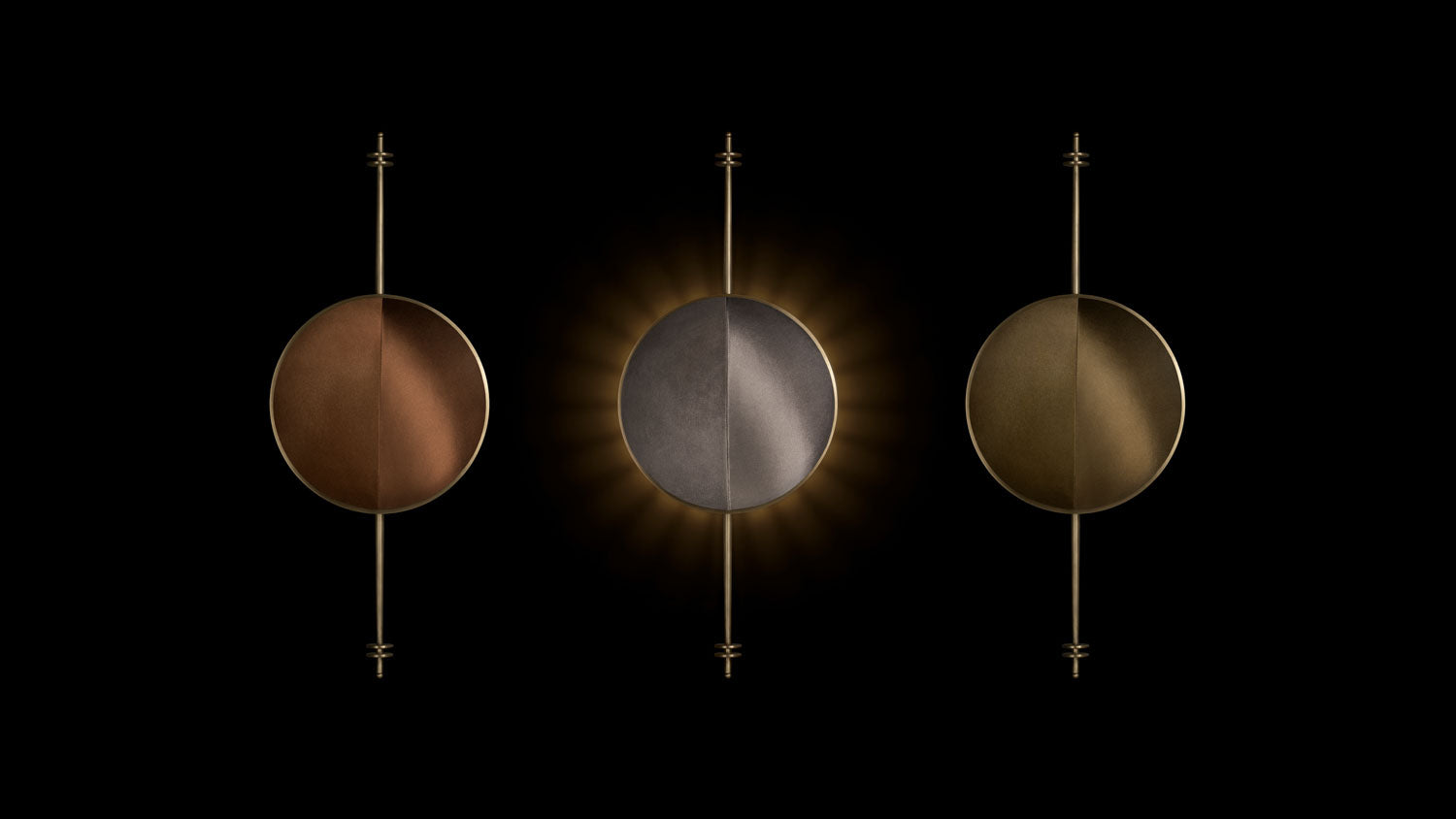 A trio STARLET sconces in an assortment of material colors and metal finishes, mounted to a black wall.