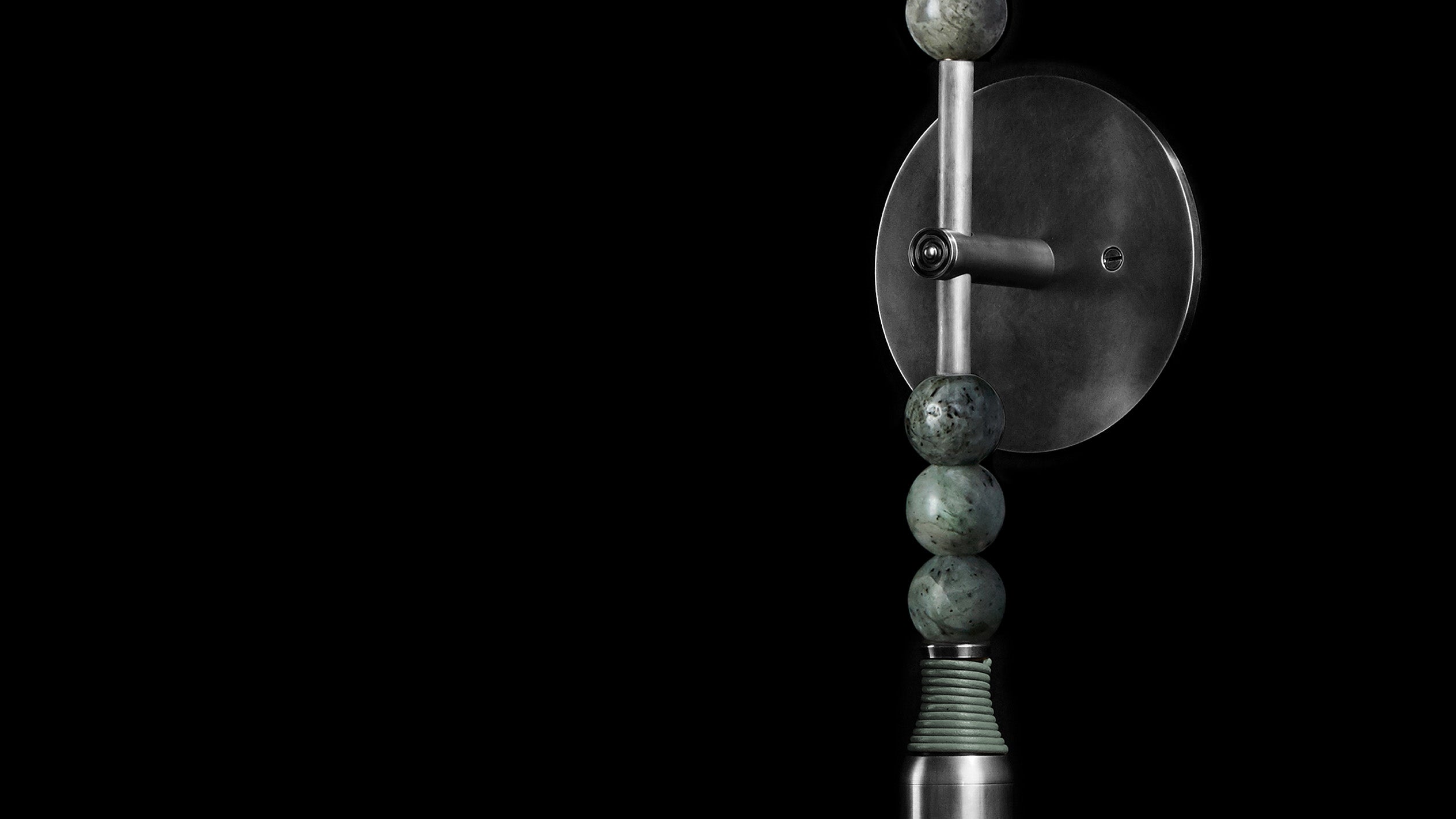 Close up of the TALISMAN : 1 sconce showing details of the Tarnished Silver, Jade stone and Cool Gray Leather. 