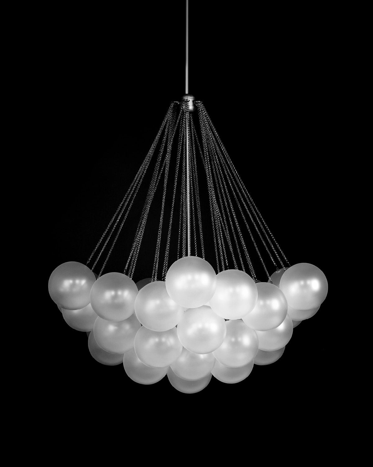 CLOUD : 37 chandelier in Tarnished Silver, hanging against a black background.