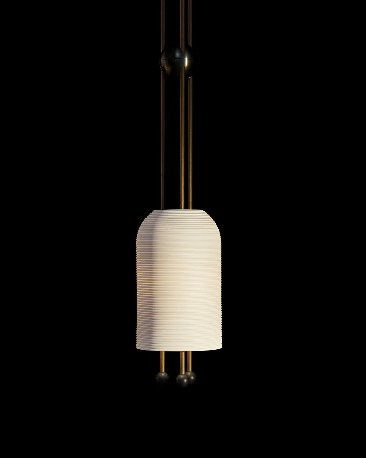 LANTERN ceiling pendant in Aged Brass and Blackened Brass finish hanging against a black background. 