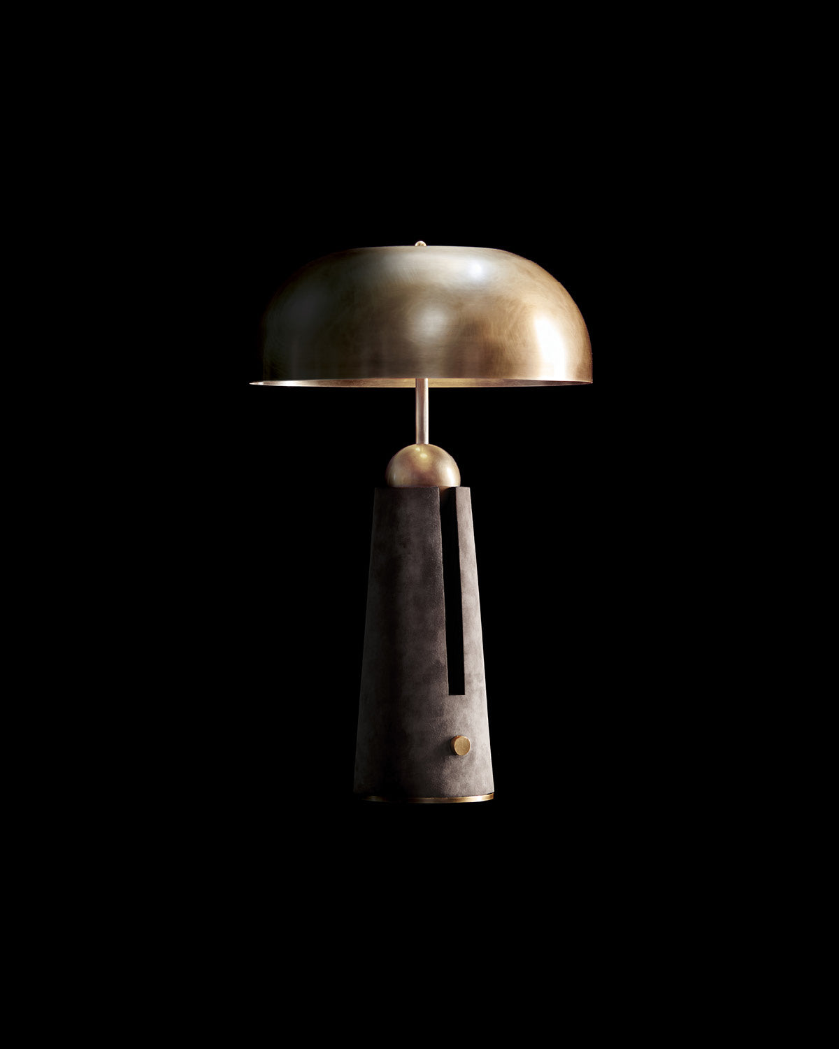 METRONOME table lamp in Aged Brass finish with Pewter Suede against a black background. 