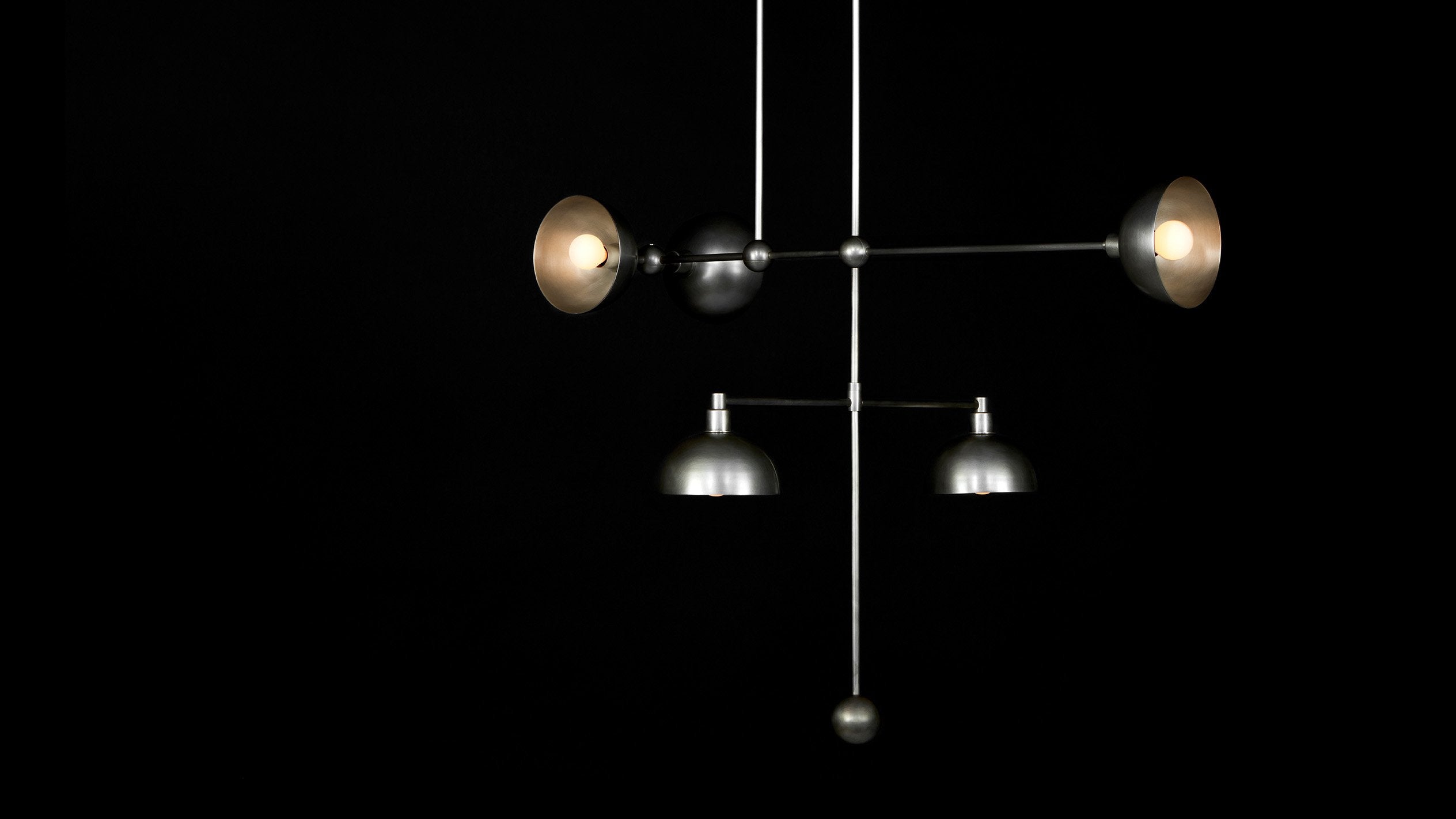 TRAPEZE : 5 MOBILE ceiling pendant in Tarnished Silver finish, hanging against a black background. 